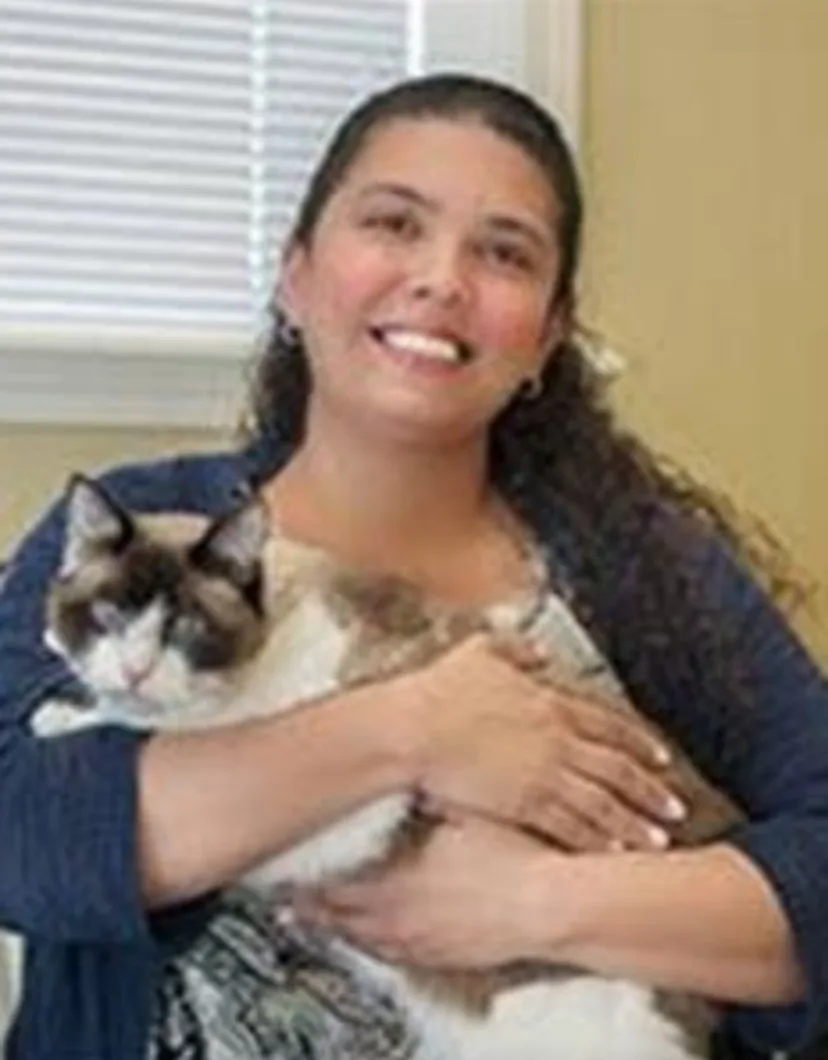 Michelle Falcon holding a cat at Tall City Veterinary Hospital